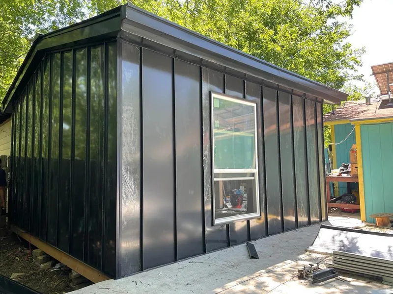 Black standing seam metal wall panels for Roof Inspection in Linton Hall